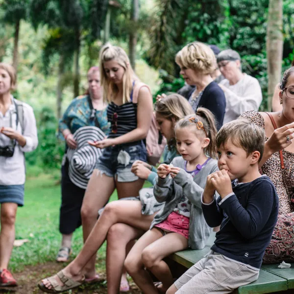 Tour Group Sampling Hawaiian fruit